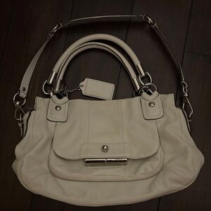 Coach Kristin leather hobo bag in an off-white or ivory color.